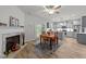 Bright kitchen and breakfast nook boasts gray cabinets, stainless appliances, and breakfast table for relaxed meals at 24 W Catalina Ct, Clayton, NC 27527