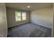 Bedroom featuring two large windows allowing for ample natural light and outdoor views at 240 Eason Creek Way, Clayton, NC 27527