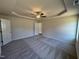 Spacious bedroom with a trey ceiling, fan, neutral walls, and plush carpeting at 240 Eason Creek Way, Clayton, NC 27527