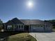 New home showing a charming gray facade, three car garage, and well maintained lawn at 240 Eason Creek Way, Clayton, NC 27527