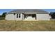 Exterior of home showing backyard with grey siding, and a patio at 240 Eason Creek Way, Clayton, NC 27527