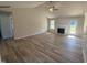 Bright living room featuring hardwood floors, a fireplace, ceiling fan, and an open floorplan at 240 Eason Creek Way, Clayton, NC 27527