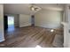 Spacious living room with hardwood floors, vaulted ceilings, fan, and abundant natural light at 240 Eason Creek Way, Clayton, NC 27527