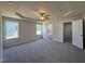 Spacious main bedroom with carpet floors, a ceiling fan, a walk-in closet, and ample natural light at 240 Eason Creek Way, Clayton, NC 27527