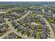 Wide aerial shot showcases the beautiful neighborhood and surrounding green spaces, offering a serene atmosphere at 241 Fishburn Dr, Apex, NC 27523