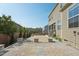 Backyard with brick patio and manicured garden, creating a serene and inviting outdoor space at 241 Fishburn Dr, Apex, NC 27523