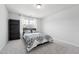 Bedroom with large window and black bookshelf at 241 Fishburn Dr, Apex, NC 27523