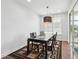 Dining room features a modern chandelier and glass patio doors at 241 Fishburn Dr, Apex, NC 27523