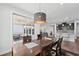 The dining area opens to an outdoor covered patio and modern open kitchen at 241 Fishburn Dr, Apex, NC 27523
