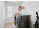 Bright laundry room with front loading washer and dryer at 241 Fishburn Dr, Apex, NC 27523