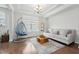 Bright living room offers a comfortable seating area with modern decor and large windows at 241 Fishburn Dr, Apex, NC 27523