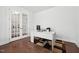 Home office with white desk and french doors at 241 Fishburn Dr, Apex, NC 27523