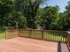 This outdoor back deck has a wood surface and backyard garden views at 2434 Morningside Dr, Burlington, NC 27217