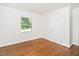 Clean, bright bedroom with gleaming hardwood floors, neutral paint and lots of natural light at 2434 Morningside Dr, Burlington, NC 27217