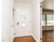 Bright entryway featuring a unique front door with decorative windows and hardwood floors at 2434 Morningside Dr, Burlington, NC 27217