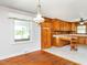 Bright kitchen featuring hardwood floors and wood cabinets at 2434 Morningside Dr, Burlington, NC 27217