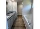 Beautiful bathroom featuring double vanities, soaking tub, granite counters, and modern fixtures at 245 Eason Creek Way, Clayton, NC 27527