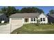 Charming one-story home featuring a two-car garage and a well-manicured lawn and concrete driveway at 245 Eason Creek Way, Clayton, NC 27527