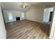 Spacious living room with high ceilings, fireplace, ceiling fan, and sliding glass door to the backyard at 245 Eason Creek Way, Clayton, NC 27527