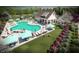 A resort-style community pool featuring a bath house, plenty of chairs, and areas to lounge, relax, and meet new friends at 253 Hank Way, Angier, NC 27501