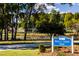 Sign for Neill's Creek Park, highlighting recreational space with ball fields and a lake at 253 Hank Way, Angier, NC 27501
