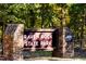 Entrance sign to Raven Rock State Park, inviting visitors to explore nature trails and outdoor adventures at 253 Hank Way, Angier, NC 27501