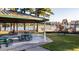 Covered picnic area with tables, overlooking playground, lake, and recreational facilities at 253 Hank Way, Angier, NC 27501