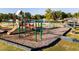 Well-equipped playground with slides, swings, and climbing structures near a calm lake at 253 Hank Way, Angier, NC 27501