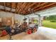 View into the garage, showing ample storage space, and the home in the background at 2646 Laurel Mill-Centerville Rd, Louisburg, NC 27549