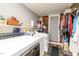 Laundry room with wooden accents, shelving, and a washer and dryer at 2646 Laurel Mill-Centerville Rd, Louisburg, NC 27549