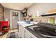 Well-lit laundry room with modern appliances and rustic wood accents at 2646 Laurel Mill-Centerville Rd, Louisburg, NC 27549