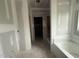 Bathroom featuring a soaking tub and walk-in shower. Unfinished at 2760 Rains Mill Rd, Princeton, NC 27569