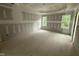 Unfinished bedroom with a tray ceiling and two large windows at 2760 Rains Mill Rd, Princeton, NC 27569