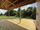 Expansive wooden deck with natural wood finish, perfect for outdoor living and enjoying the serene backyard view at 2760 Rains Mill Rd, Princeton, NC 27569