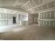 Unfinished living room featuring high ceilings, and an open-concept floor plan at 2760 Rains Mill Rd, Princeton, NC 27569