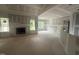 Unfinished living room featuring high ceilings, a fireplace, and large windows at 2760 Rains Mill Rd, Princeton, NC 27569