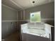 Unfinished main bathroom showing tub area, ready for customization and finishes at 2760 Rains Mill Rd, Princeton, NC 27569