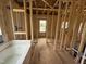 Bathroom with wood-frame construction, window, and modern soaking tub at 2776 Rains Mill Rd, Princeton, NC 27569
