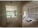 Spacious interior of a home under construction with drywall installed, offering a glimpse of the outdoors through the windows at 2776 Rains Mill Rd, Princeton, NC 27569