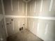 Under-construction laundry room with drywall installed and hookups ready for appliances at 2776 Rains Mill Rd, Princeton, NC 27569