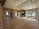 Large open-concept living room featuring wood-frame construction, insulation, and window views at 2776 Rains Mill Rd, Princeton, NC 27569