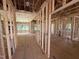 Open-concept living room with wood-frame construction, insulation, and views to exterior at 2776 Rains Mill Rd, Princeton, NC 27569