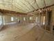 Open-concept living room featuring wood-frame construction, high ceilings, and window views at 2776 Rains Mill Rd, Princeton, NC 27569