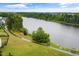 Breathtaking aerial view showcasing the serene lake and surrounding green landscape, ideal for nature lovers at 2855 Wilkes Lake Dr, Fuquay Varina, NC 27526