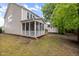 Backyard featuring a cozy screened porch and a storage shed for added convenience at 2855 Wilkes Lake Dr, Fuquay Varina, NC 27526