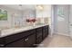 Elegant bathroom with double vanities, granite countertops, and a glass-enclosed shower for a spa-like experience at 2855 Wilkes Lake Dr, Fuquay Varina, NC 27526