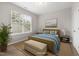 Relaxing bedroom with natural light, comfortable bedding, and stylish decor, creating a serene space at 2855 Wilkes Lake Dr, Fuquay Varina, NC 27526