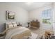 Comfortable bedroom features natural light, soft linens, and cozy decor, creating a relaxing space at 2855 Wilkes Lake Dr, Fuquay Varina, NC 27526