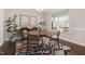 Bright dining room with a wood table, stylish chairs, and an area rug at 2855 Wilkes Lake Dr, Fuquay Varina, NC 27526