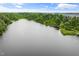 Expansive lake view surrounded by lush greenery, offering a peaceful and picturesque setting for relaxation at 2855 Wilkes Lake Dr, Fuquay Varina, NC 27526